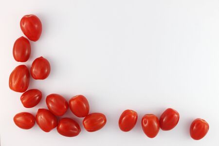 cherry tomatoes on a white backgroundの写真素材