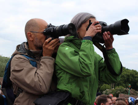 press and media camera working on public news coverage eventのeditorial素材