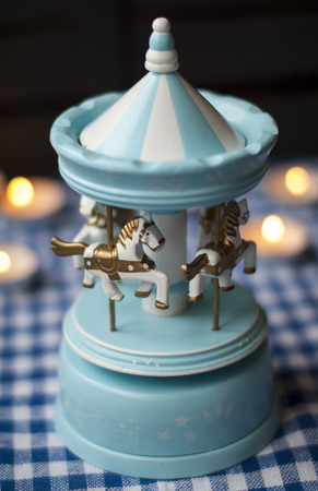 Christmas gift blue carousel and candlesの写真素材