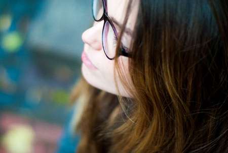 Young woman in transparent glasses. Student wearing glasses for vision.の写真素材