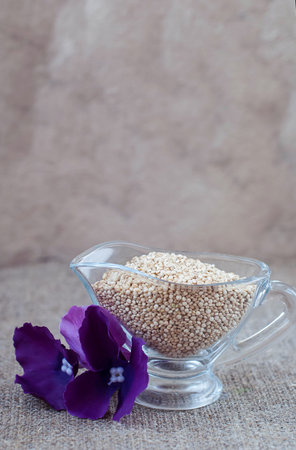 Krupa kinoa in glassware on a linen tableclothの写真素材