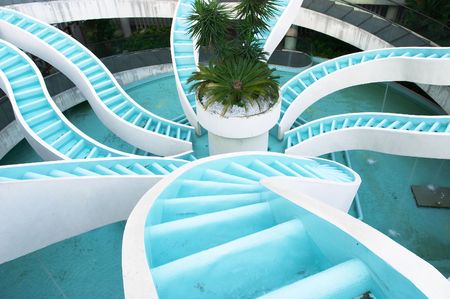 Spiralling converging waterfall, fountain, spiraling and convergene can be used conceptuall to indicate convergence of ideas, technology, consolidation. Or representing multipl sources feeding to one destinationの写真素材