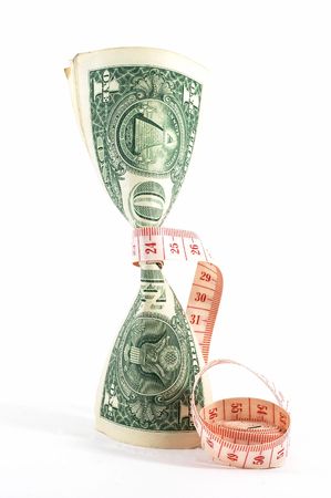 Measuring tape over money, budgeting, measure money, tight budget. Money upright. Could also signify expensive slimming treatment.の写真素材