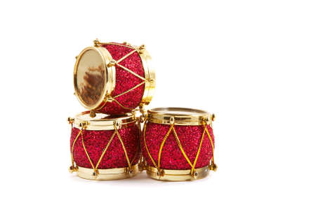 Christmas decoration, three red & gold drums isolated on white background. Horizontal, landscape orientation.の写真素材