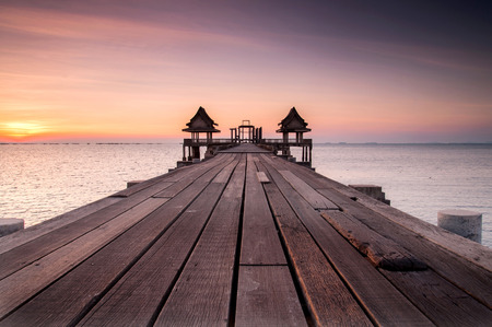 Wooded bridge in the port between sunrise.の写真素材