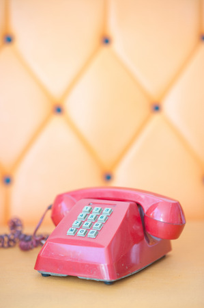 old red telephone on sofaの写真素材