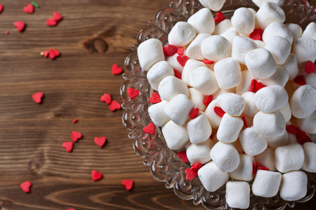Marshmallows in glasswares on a wooden backgroundの写真素材