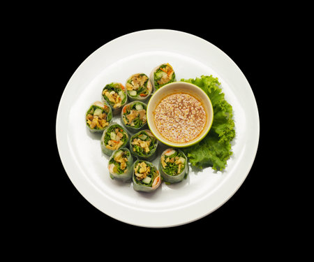 Thai fresh spring rolls on black background