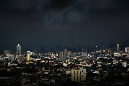 Gray rain cloud at cityscapes in twilightの写真素材