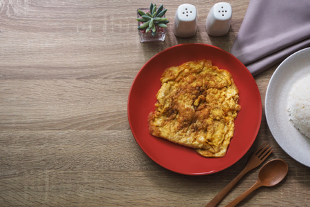 Texture brown wooden for background consist of omelet and other side dishes. Copy spaceの写真素材