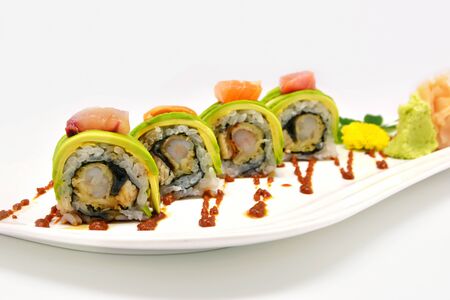 Maki roll avocado in white plate on white backgroundの写真素材