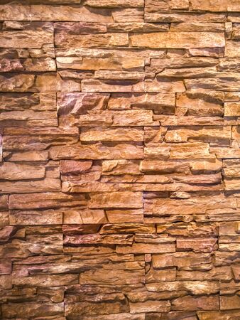 Orange grunge brick wall for backgroundの写真素材