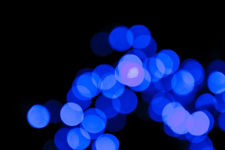 blue bokeh on black backgroundの写真素材
