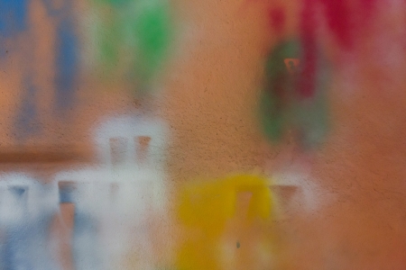 Spray paint on orange wall.の写真素材