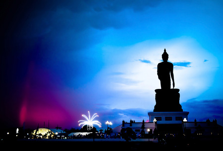 The big black buddha with blue sky background and shadowの写真素材