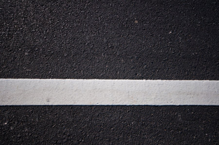 Asphalt road with separation white lines