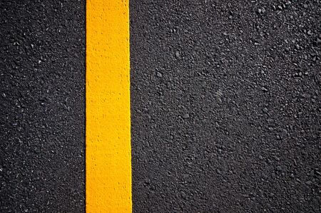 Asphalt road with separation yellow linesの写真素材