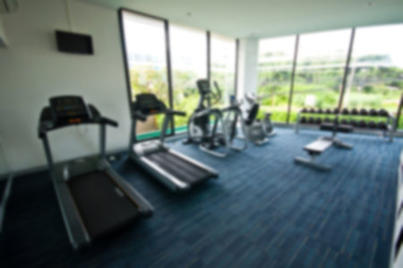 Abstract blur fitness room interior for background