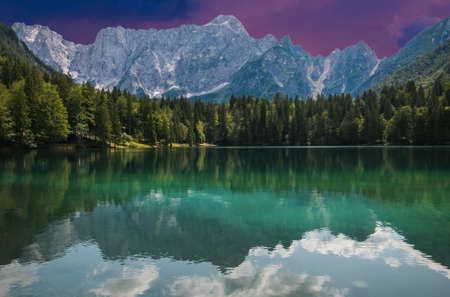 Upper Lake of Fusine during summer sunset. Emerald waters. Tarvisio to be discovered. Friuliの写真素材