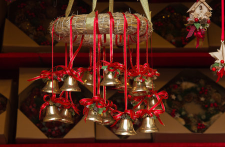 Close up of hanging bells at the traditional christmas market in the main square of Bressanone in Alto Adige, Italyの写真素材