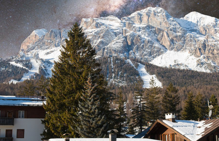 Night view of Cortina d'Ampezzo touristic city with dolomites in the background, Veneto region, Italyの写真素材