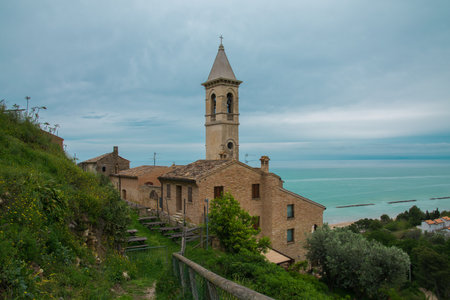View of old roman church of Santa Maria del Suffragio in the medieval center of Cupra Marittima over the adriatic sea, Marche region, Italyの写真素材