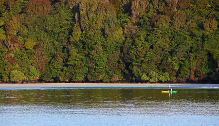 Kayaker in Stewart island, New Zealandの写真素材