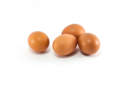 four eggs on white background.