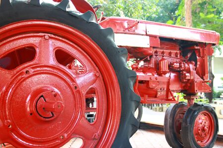 Small red tractor, the vehicle used in agriculture or constructionの写真素材