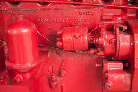 Small red tractor, the vehicle used in agriculture or constructionの写真素材
