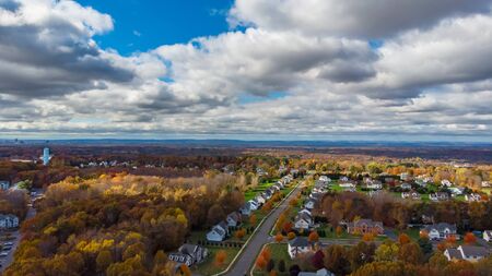 Aerial view of the beautiful autumn area with yellow and red treesの写真素材