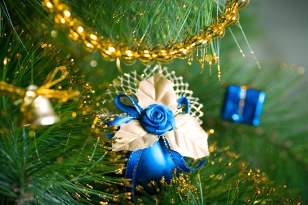 Beautiful color christmas decorations hanging on christmas tree with shiny glareの写真素材