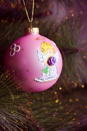 Beautiful color christmas decorations hanging on christmas tree with shiny glareの写真素材