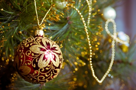 Beautiful color christmas decorations hanging on christmas tree with shiny glareの写真素材
