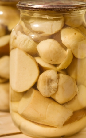 Delicious marinated mushrooms in jarの写真素材