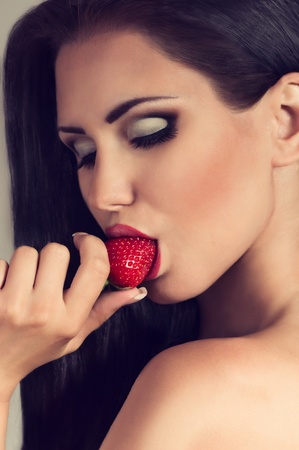 Young woman with strawberryの写真素材