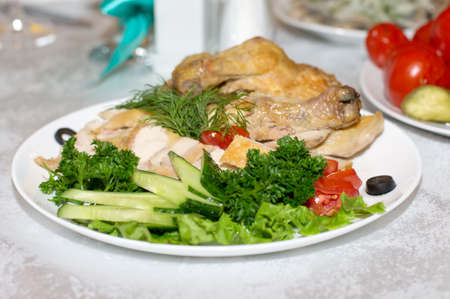 Roast chicken with vegetables and saladの写真素材