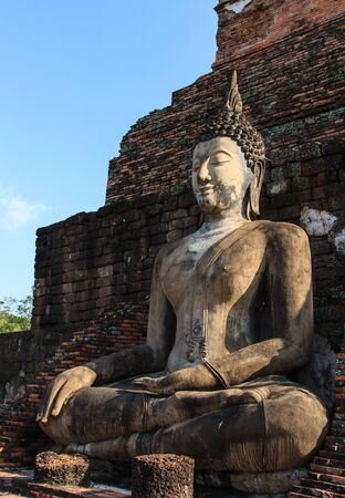 An ancient Buddha image at Sukhothai historical park, Thailandの写真素材