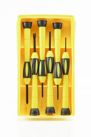 Screwdriver in the yellow package, isolated on white backgroundの写真素材