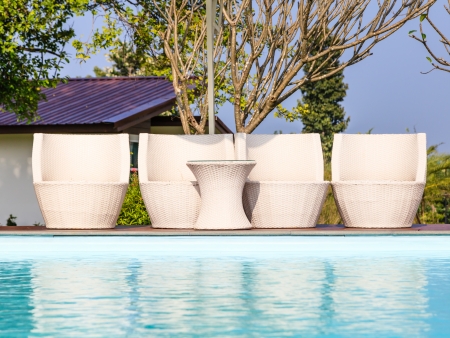 swimming pool white chairs and the tableの写真素材