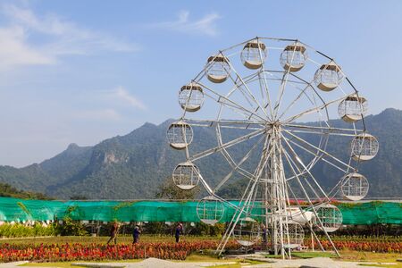 A white ferris wheel in farm, front viewの写真素材