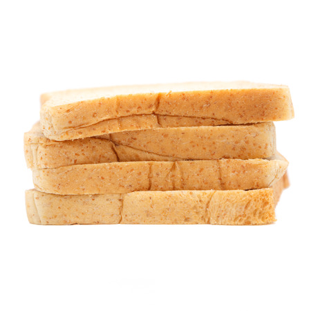 loaf of sliced wholewheat bread isolated on whiteの写真素材