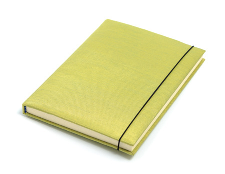 Green notebook isolated on white backgroundの写真素材