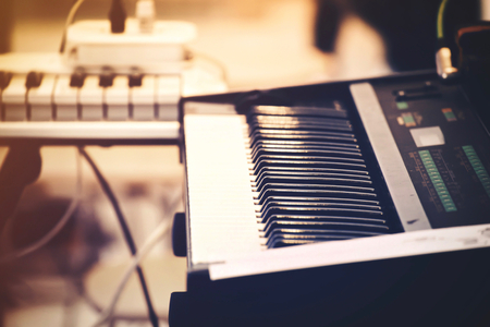 Selective focus of Piano keyboard or Piano instrument. Film tone (Orange, blue, purple).の写真素材