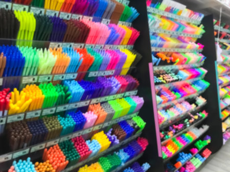 Blurred of stationery shop with many accessories such as pen, pencil, eraser, color, correction pen,...