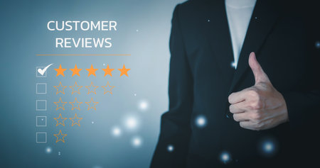 Customer reviews 5 Stars. Customer service evaluation and satisfaction. Smile rating to feedback survey concept. Man wearing black suit and Hand making good sign.の写真素材