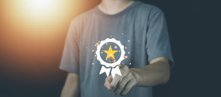 Businessman with tablet and sign of the top service and star. ISO certification, Guarantee, Quality assurance, Standards and standardization concept. Customer service evaluation and satisfaction.の写真素材