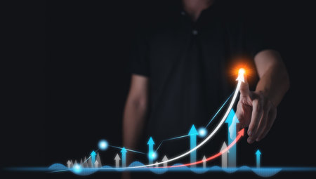 Success business concept. Businessman hand touch hologram of Stock chart or Cryptocurrency chart. Statistics graph and char growing graph of Planning and strategy concept.の写真素材