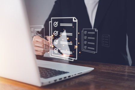 Electronic signature or e-signing. Document Management System (DMS). Digital online document database and paperless office. Businessman is sign signature with notebook (Laptop).の写真素材