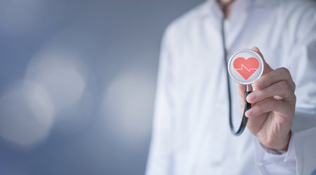 Heart on stethoscope. Cardiologist doctor examine patient of cardiovascular system. Medical technology and heart functions and blood vessel concept. Healthcare treatment to diagnose heart disorders.の写真素材